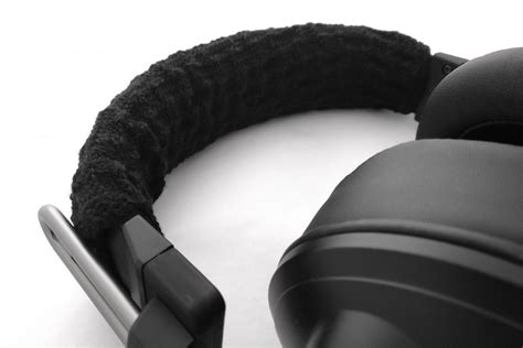 metal and a fabric band on a headset called|what does a headphones cover.